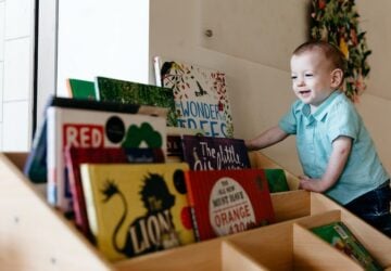 Toddler Looking at Books