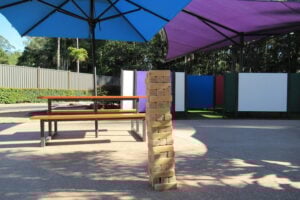 Mega Jenga and picnic table at Amaze World.