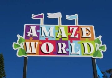 Colourful Amaze World sign and blue skies.
