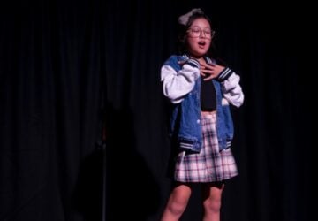 BeXD Create young girl performing on stage.