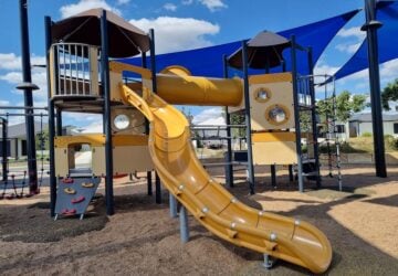 Yellow slide and playground at Bumble Bee Park.