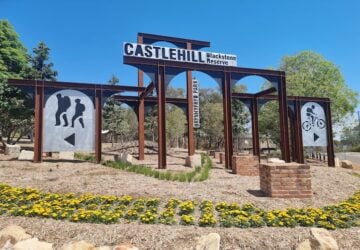 Main signage in garden at entrance to Castle Hill Blackstone Reserve Mountain Bike Trails.