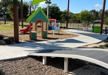 Bumpy bridge and playground in background at Hemmant Scooter Park-Paul Conti Park.