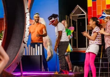 Holey Moley Chermside kids party mini golf group laughing.