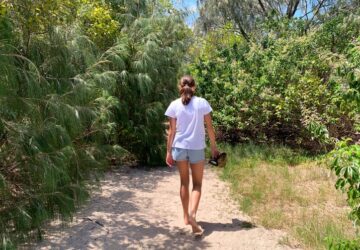 Girl walking on beach track on King Island, Wellington Point