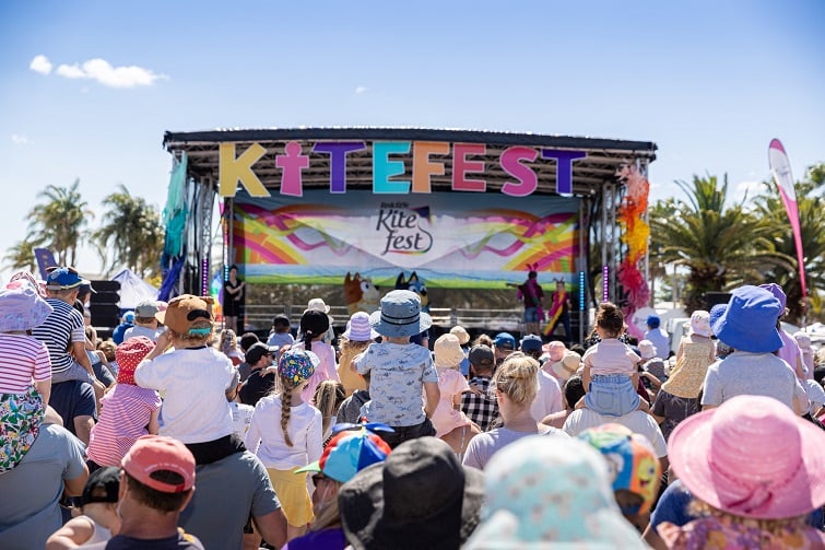 Kiefest event image of Bluey and Bingo on stage with lots of kids in the crowd and parents watching the live show.