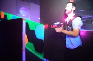 Laserzone adult playing laser tag.