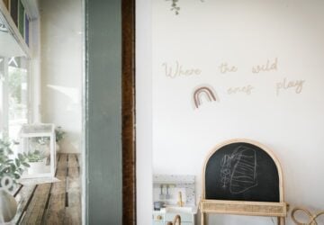 Milk + Honey store entrance blackboard and wall sign.