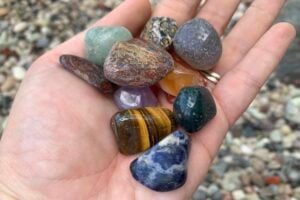 Gems in a hand at Opals Down Under.