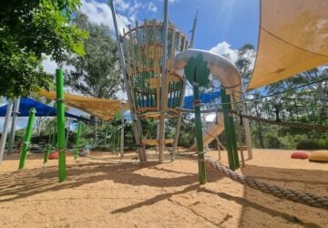 Playground including a large climbing tower at Pebble Creek Parklands.