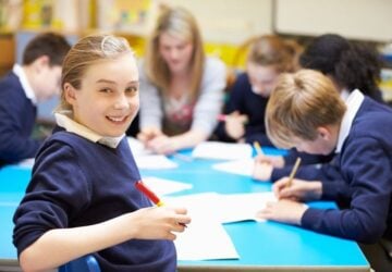 Students at desk writing.