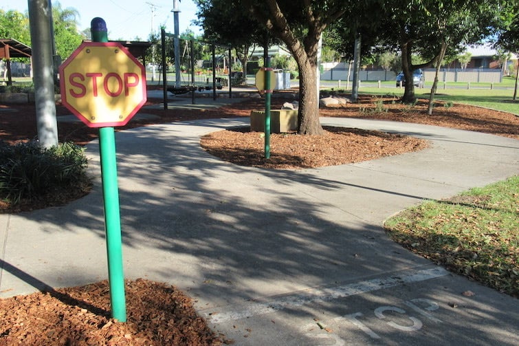 Play stop sign on mini traffic track at Symphony Crescent Park.
