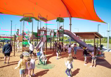 Children playing in the Village Green playground.