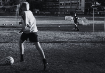 GOALS Soccer kids playing soccer outside black and white image.