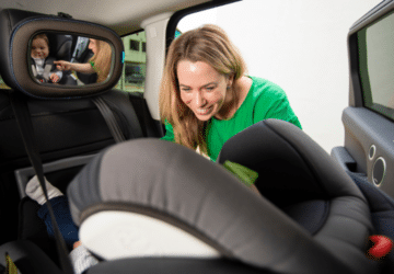 free car seat fitting in brisbane, child being fitted for her car seat.