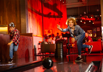 Strike Bowling kids bowling in lanes.